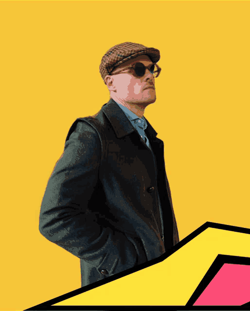a man wearing sunglasses and a plaid hat stands in front of a yellow background