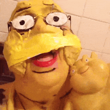 a cartoon character with glasses and a yellow hat on