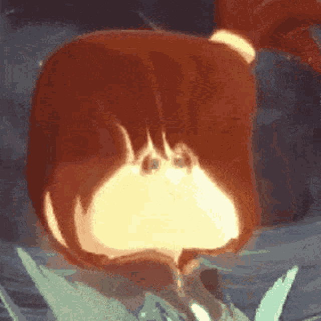 a close up of a cartoon character 's butt with a flame coming out of it .