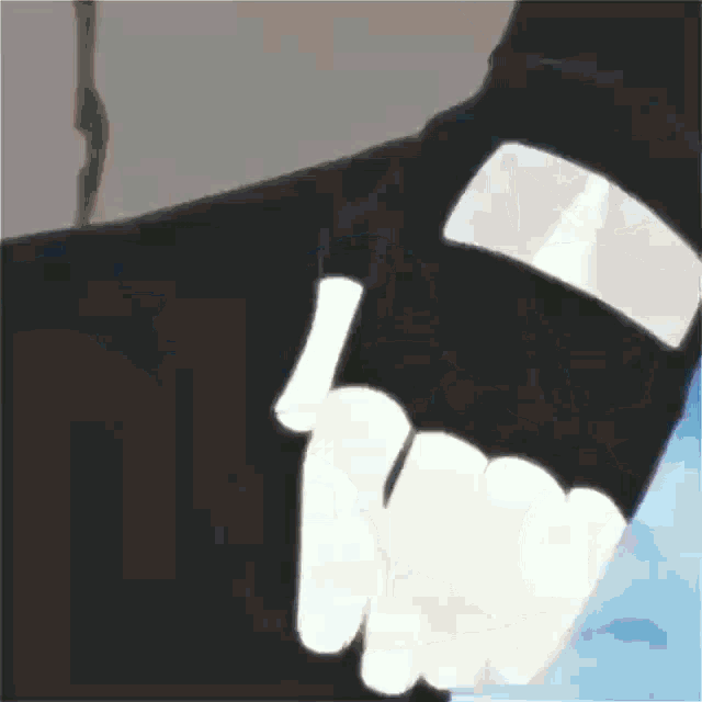 a close up of a person 's hand wearing a pair of black gloves with white fingers .