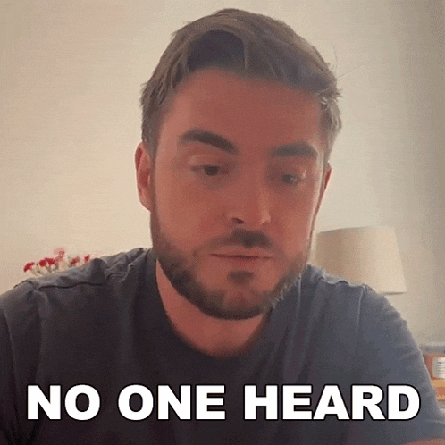 a man with a beard says " no one heard " in front of him