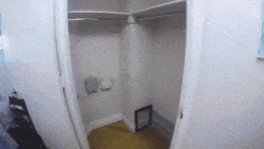 a closet with a picture frame in it and a sign that says ' a ' on it