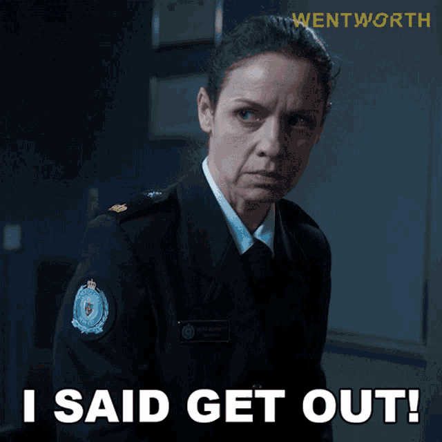 a woman in a military uniform says " i said get out "
