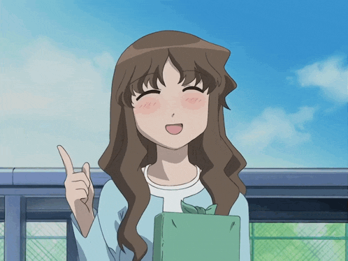 a girl with long brown hair is holding a book and pointing up