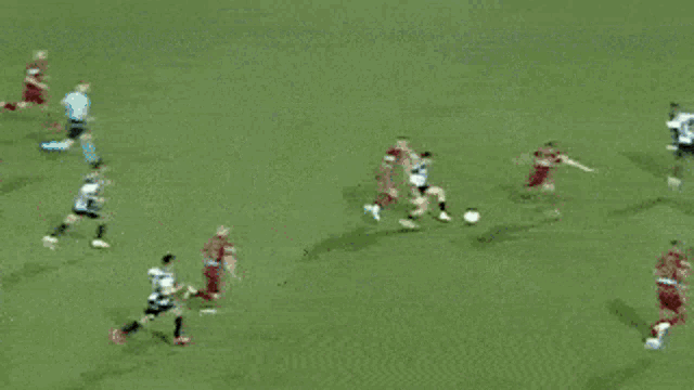 a soccer goalie is diving to block a shot on the goal