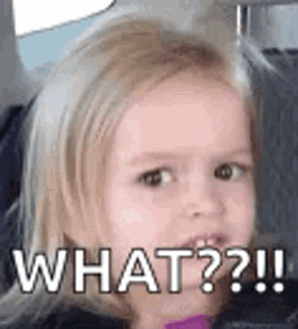 a little girl is sitting in a car and making a funny face and saying what ?