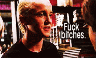 a woman with blonde hair says fuck bitches in front of a pile of books