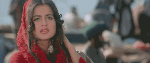 a woman wearing a red scarf on her head