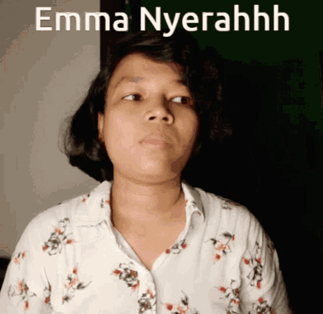 a woman in a floral shirt with the words emma nyereahhh on the bottom