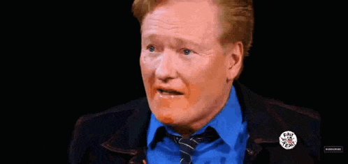 a man in a blue shirt and tie is saying i 'm perfectly fucking fine