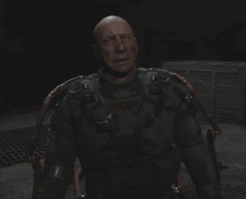 a bald man in a military uniform has a patch on his chest that says ' target ' on it