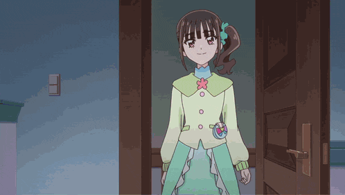 a girl with a flower in her hair is standing in front of a door