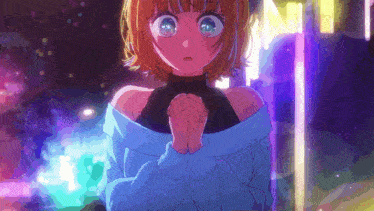 a girl in a blue sweater is praying with her hands folded in front of a neon sign .