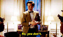 a man in a suit and bow tie is standing in a room and says no you don 't
