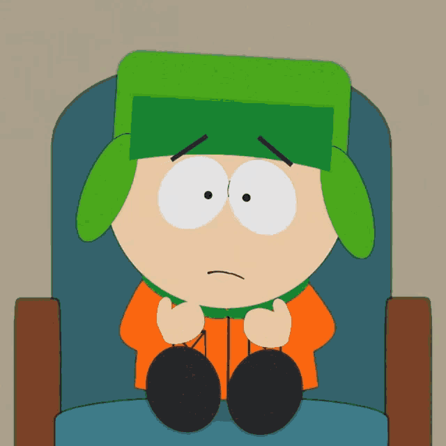 a cartoon character is sitting in a chair with his head down
