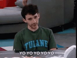 a young man wearing a green tulane shirt says yo yo yo yo yo