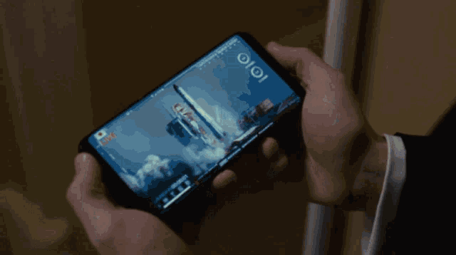 a person is holding a cell phone with a map on the screen