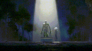 a statue of a man in a green robe is lit up by a spotlight