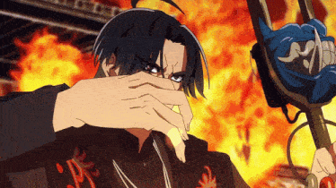 a cartoon character covering his face with his hand in front of a fire
