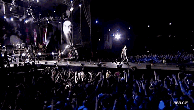 a crowd of people watching a concert with the words rbd gif on the bottom left