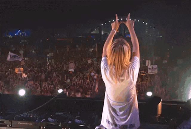 a woman in a white shirt that says magic wonderland