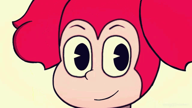 a close up of a pink cartoon character 's face with big eyes