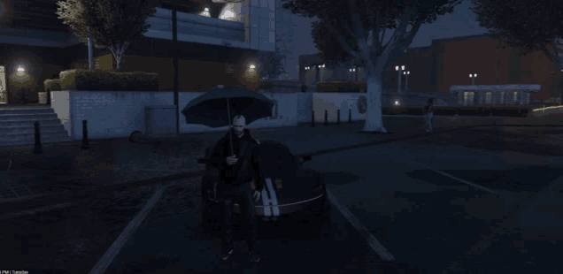 a man is holding an umbrella in front of a car with the letter h on the side