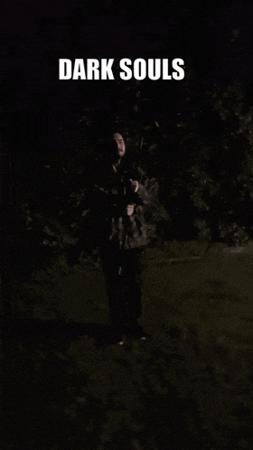a poster for dark souls shows a man in the dark