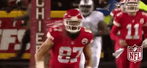 a football player wearing a red jersey with the number 87 on it