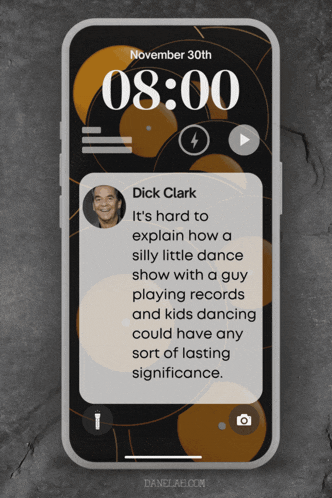 a cell phone with a quote from dick clark on it