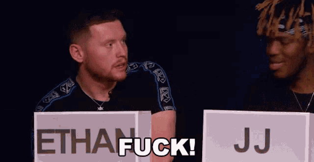 two men are standing next to each other and one of them is saying " ethan fuck jj "
