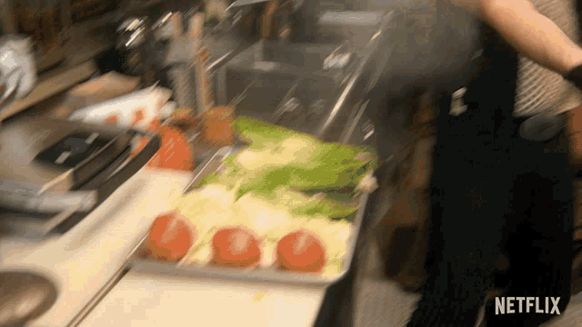 a netflix logo can be seen in the corner of a kitchen scene