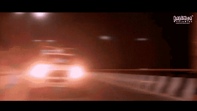 a blurry picture of a car driving down a highway with the words laugh worldwide on the bottom left