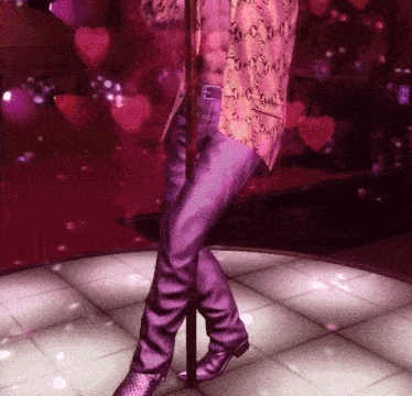 a man is standing on a pole with hearts behind him