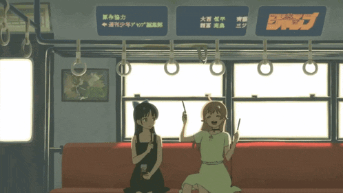 two girls are sitting on a couch with a sign above them that says jump