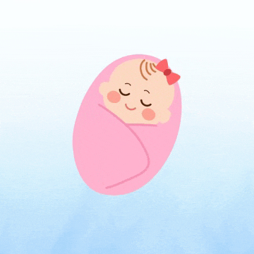 a baby wrapped in a pink blanket with a red bow on her head .
