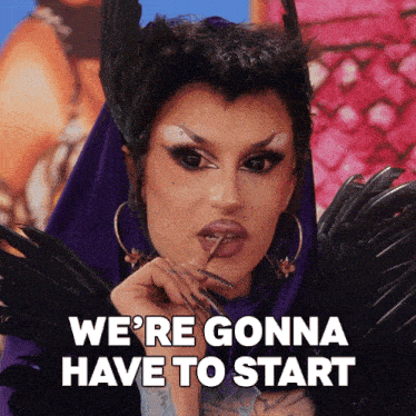 a drag queen says we 're gonna have to start while wearing feathers