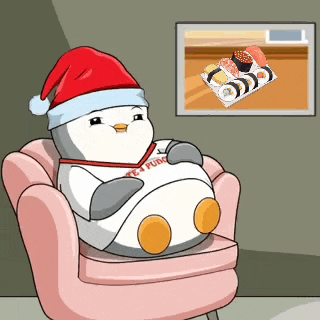 a cartoon penguin wearing a santa hat is sitting on a chair