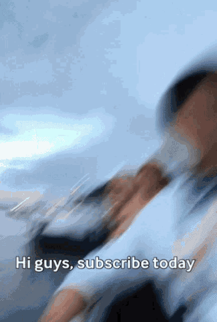 a blurry image of a person with the words hi guys subscribe today