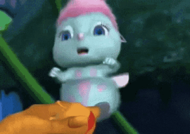 a cartoon caterpillar with a pink hat on