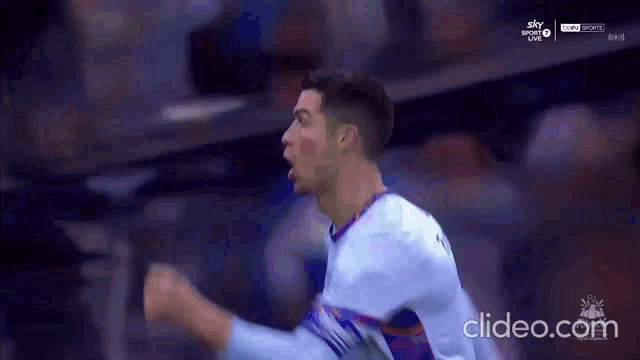 a close up of a soccer player celebrating a goal