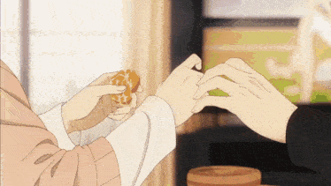 a person holding a piece of food in their hands