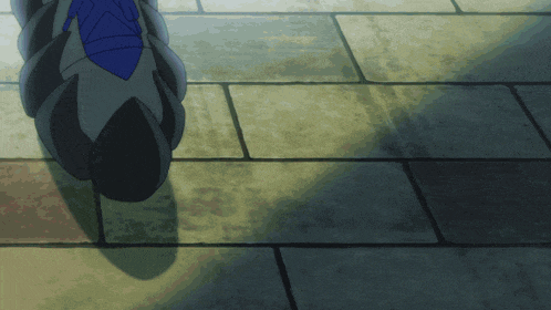 a person is walking on a tiled floor