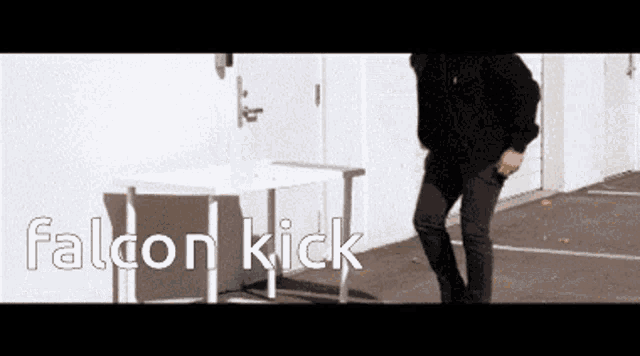 a man is standing in front of a white table with the words falcon kick written above him
