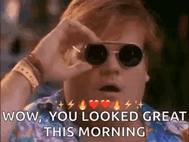 a man wearing sunglasses is looking through a pair of binoculars and says `` wow , you looked great this morning '' .