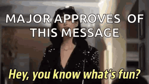 a woman is standing in a hallway and says " major approves of this message hey , you know what 's fun " .