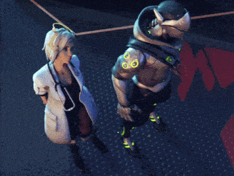 a woman in a lab coat stands next to a man in a robotic suit