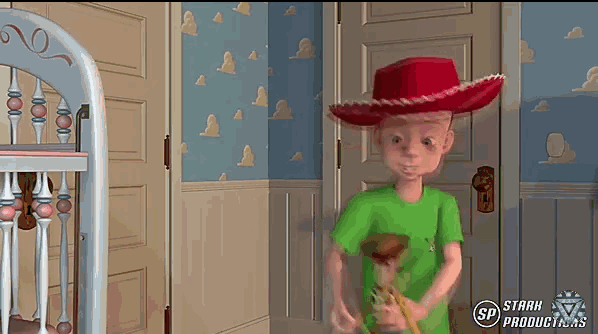 a toy story character with a red hat and a wooden toy