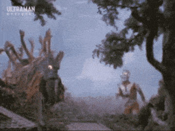 a man and a monster are standing next to each other in the woods .