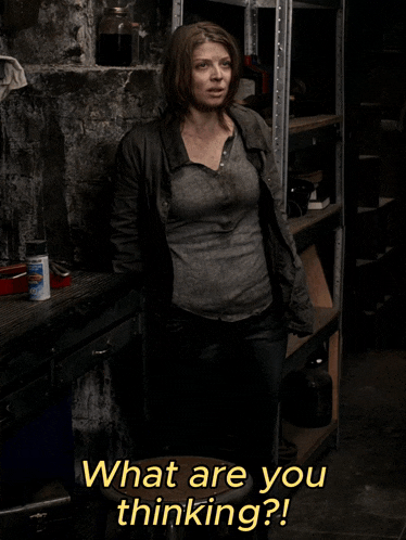 a woman standing in a dark room with the words " what are you thinking " on the bottom